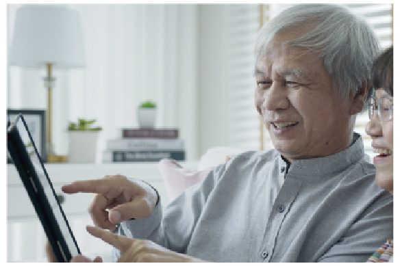 Elderly person completing procedures on a tablet